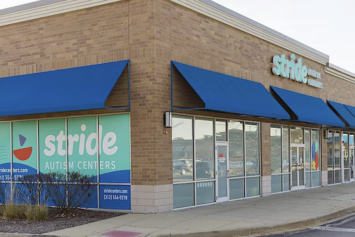 Photo of a building with a signage that reads "Stride Autism Centers."